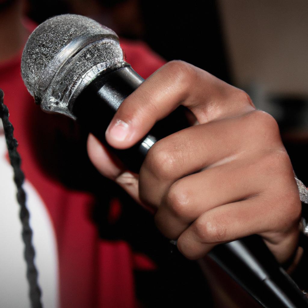 Person holding a microphone, performing