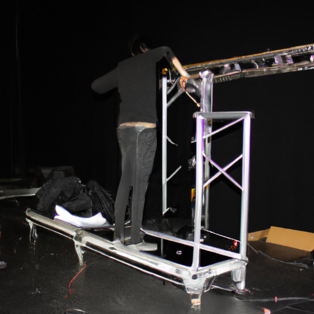 Person setting up concert stage